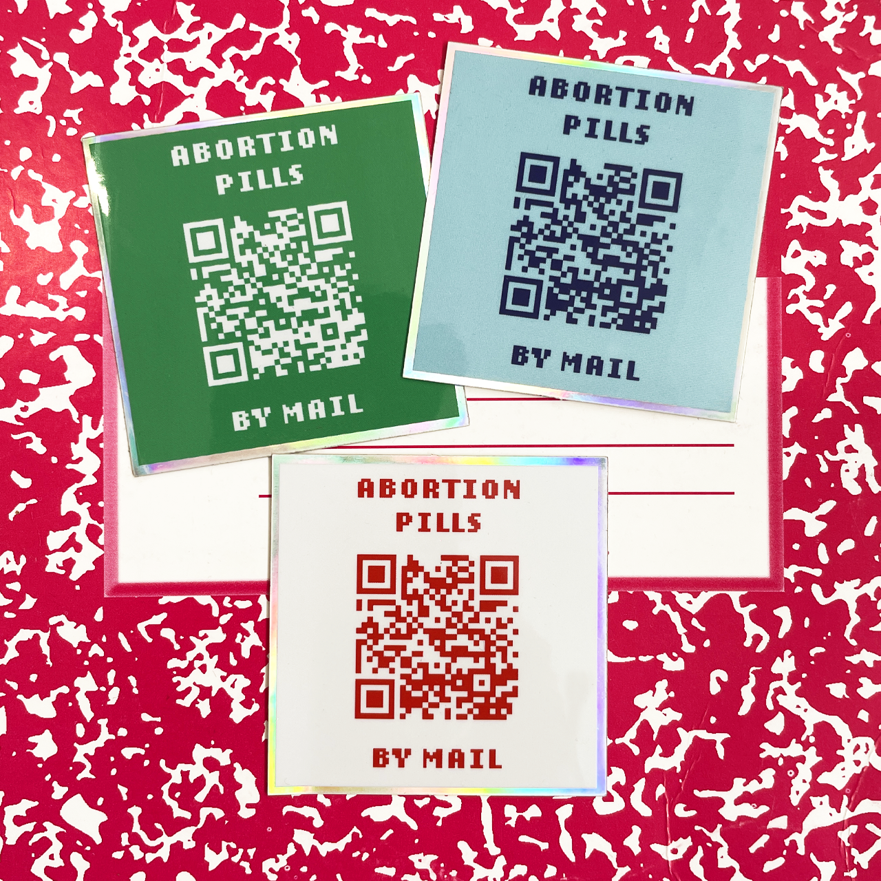 holographic stickers that says abortion pills by mail with a QR code