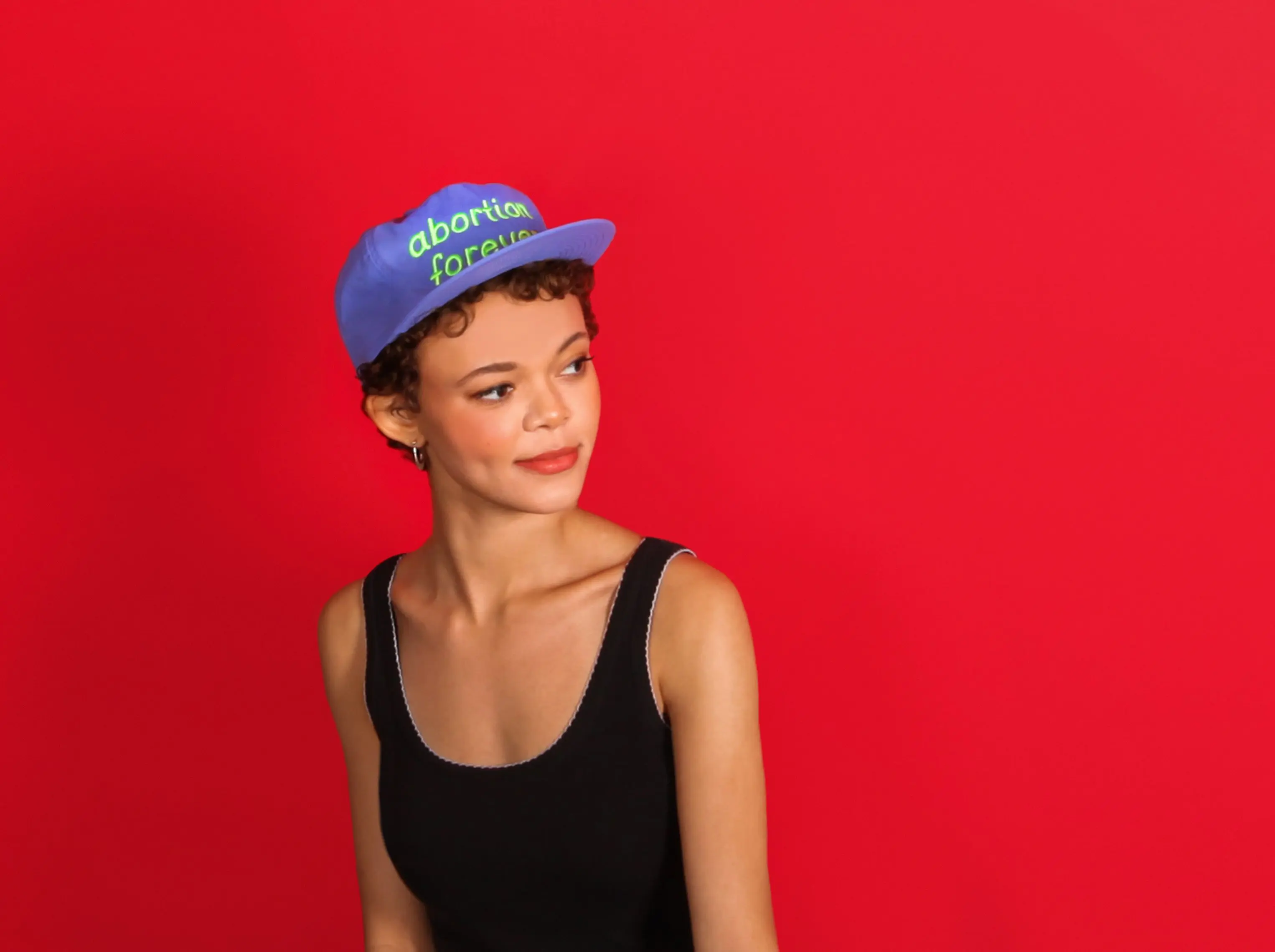 Model wearing abortion forever hat