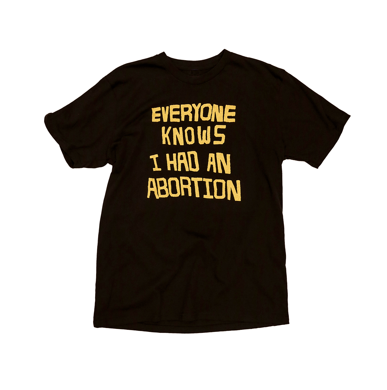 Black tee that says EVERYONE KNOWS I HAD AN ABORTION in gold